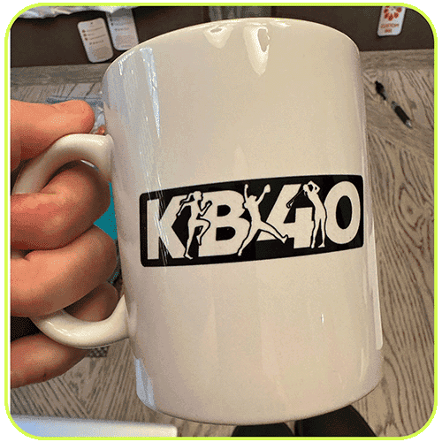 A white mug with the KB40 logo
