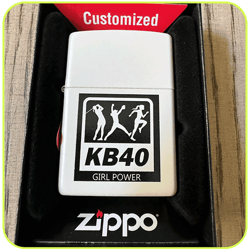 A Zippo lighter engraved with the KB40 logo