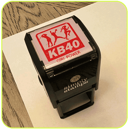 A self-inking stamp with the KB40 logo